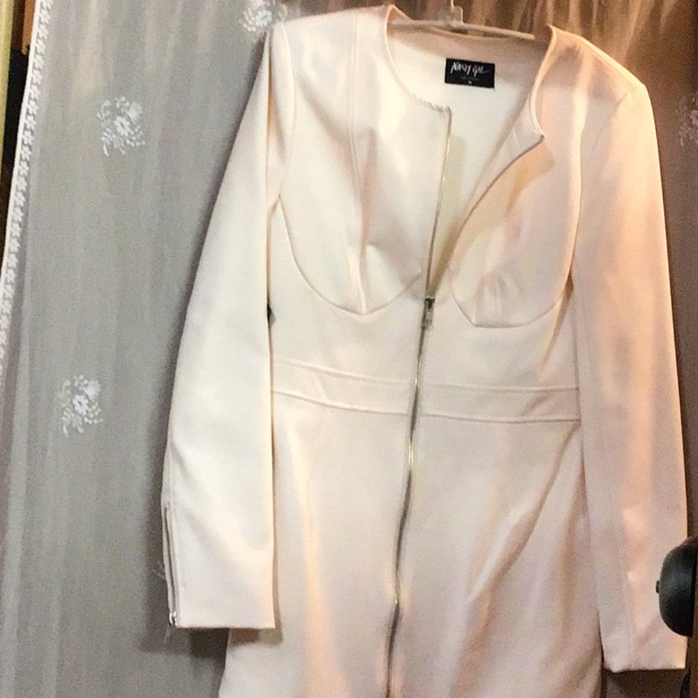 Dress with zippers in front and on sleeves.